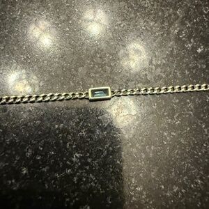 14k White Gold Bracelet with a blue Topaz stone.